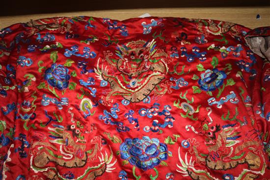 An early 20th century red satin dragon robe